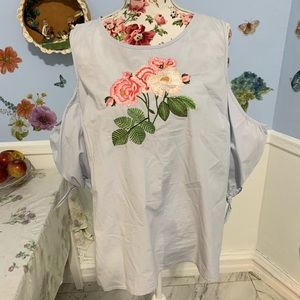 Cold shoulder top with embroidery in center